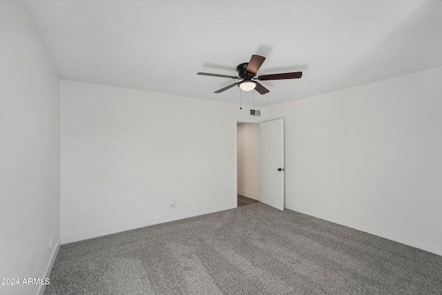 spare room with carpet and ceiling fan