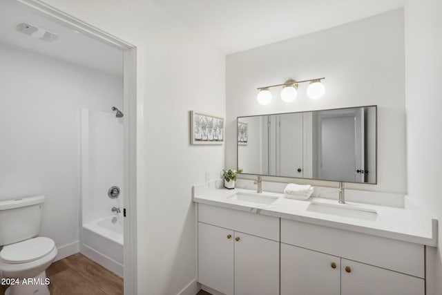 full bathroom featuring toilet, shower / bathing tub combination, vanity, and wood-type flooring