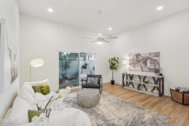 living room featuring hardwood / wood-style flooring and ceiling fan