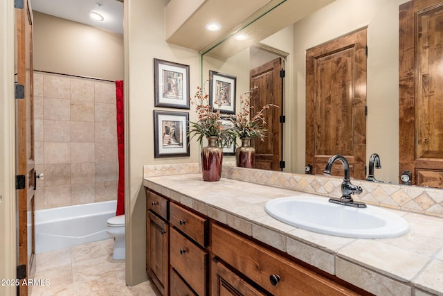 full bathroom with toilet and vanity