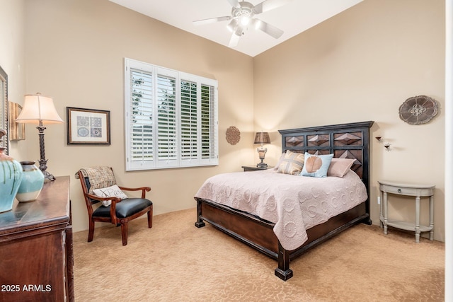 bedroom with a ceiling fan and carpet