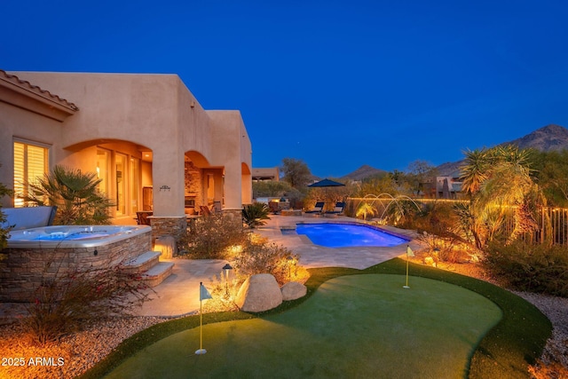 view of swimming pool with a patio, a fenced in pool, and an outdoor hot tub