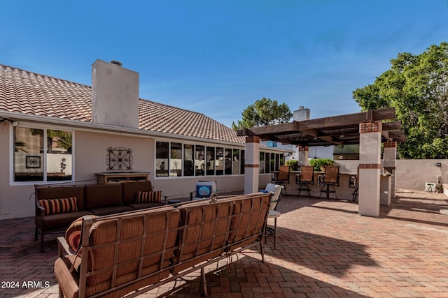 view of patio / terrace with an outdoor living space and exterior bar