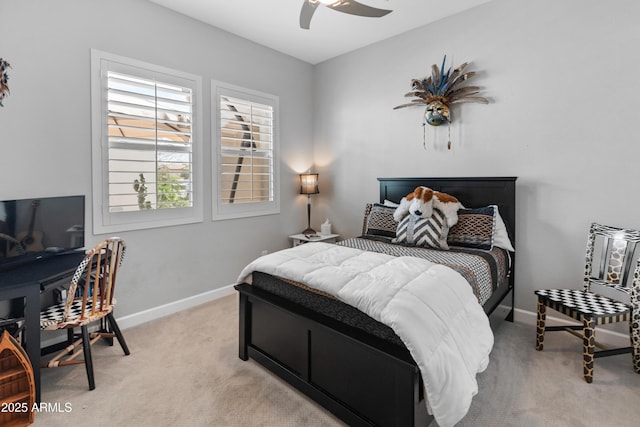 bedroom with light carpet, ceiling fan, and baseboards