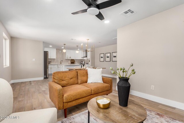 1501 E Sheridan St, Phoenix, AZ 85006 - living area featuring baseboards, recessed lighting, a ceiling fan, and light wood-style floors