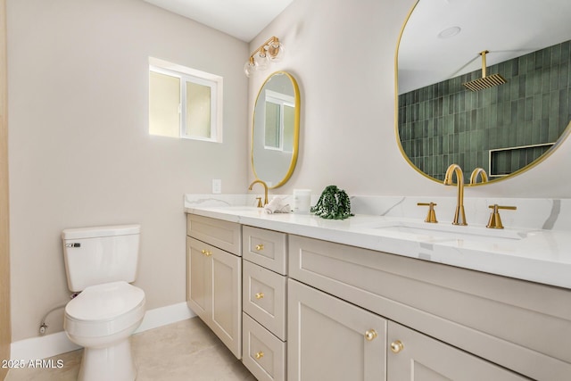 1501 E Sheridan St, Phoenix, AZ 85006 - full bathroom with double vanity, toilet, baseboards, tile patterned floors, and a tile shower