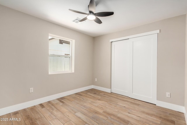 1501 E Sheridan St, Phoenix, AZ 85006 - unfurnished bedroom with baseboards, light wood-type flooring, a closet, and ceiling fan
