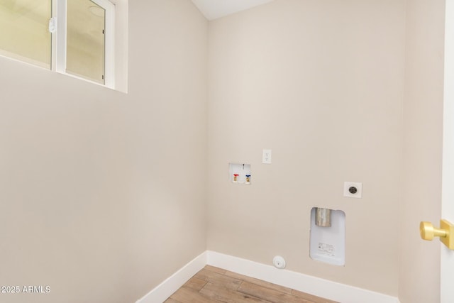 1501 E Sheridan St, Phoenix, AZ 85006 - laundry room featuring washer hookup, baseboards, light wood-style floors, electric dryer hookup, and hookup for a gas dryer