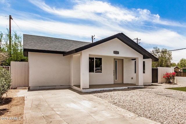 1501 E Sheridan St, Phoenix, AZ 85006 - view of front of home with roof with shingles, stucco siding, and a patio area
