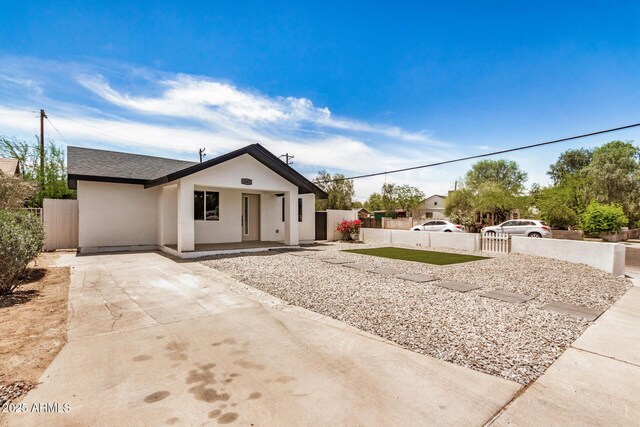 1501 E Sheridan St, Phoenix, AZ 85006 - view of front of house with stucco siding, concrete driveway, and a shingled roof
