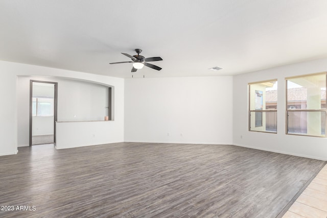 spare room with hardwood / wood-style flooring and ceiling fan