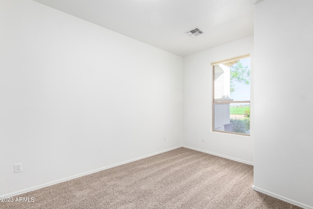 unfurnished room featuring carpet floors