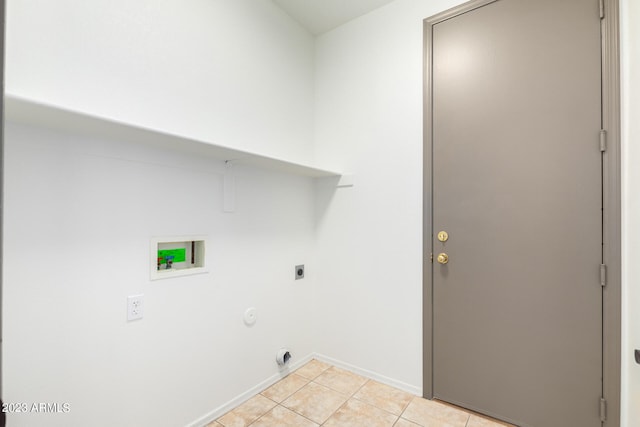 washroom with hookup for an electric dryer, washer hookup, light tile patterned flooring, and hookup for a gas dryer