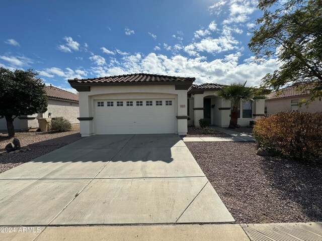 mediterranean / spanish-style house featuring a garage