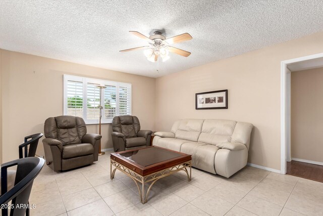 10126 W Sombrero Cir, Sun City, AZ 85373 - living area featuring ceiling fan, a textured ceiling, and light tile patterned floors