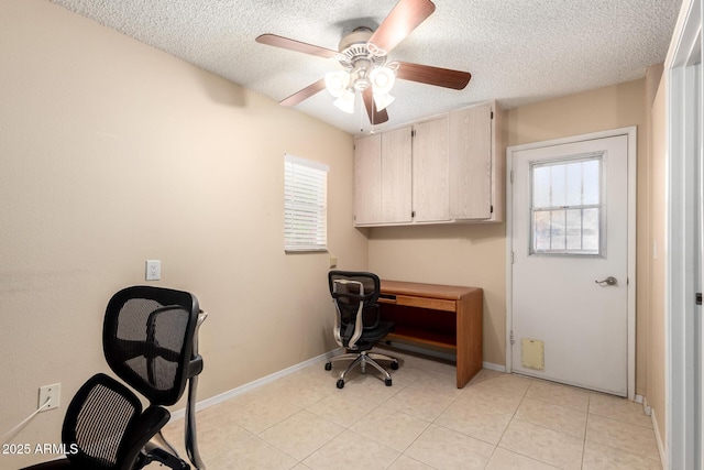 10126 W Sombrero Cir, Sun City, AZ 85373 - office area featuring a textured ceiling, healthy amount of natural light, ceiling fan, baseboards, and light tile patterned floors