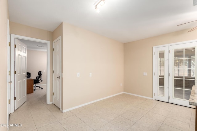 10126 W Sombrero Cir, Sun City, AZ 85373 - spare room featuring light tile patterned floors, an office area, a ceiling fan, and baseboards