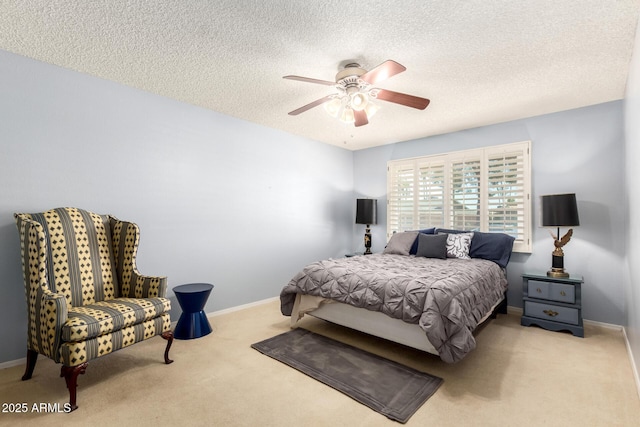 10126 W Sombrero Cir, Sun City, AZ 85373 - carpeted bedroom featuring a textured ceiling, baseboards, and a ceiling fan