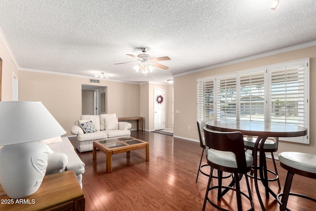 10126 W Sombrero Cir, Sun City, AZ 85373 - living room with a textured ceiling, crown molding, ceiling fan, wood finished floors, and baseboards
