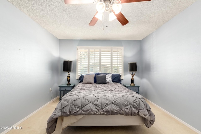 10126 W Sombrero Cir, Sun City, AZ 85373 - carpeted bedroom featuring a textured ceiling, a ceiling fan, and baseboards