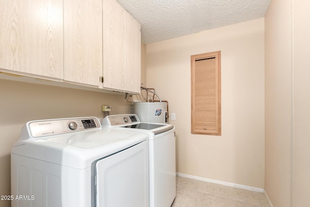 10126 W Sombrero Cir, Sun City, AZ 85373 - washroom with water heater, cabinet space, separate washer and dryer, light tile patterned flooring, and baseboards