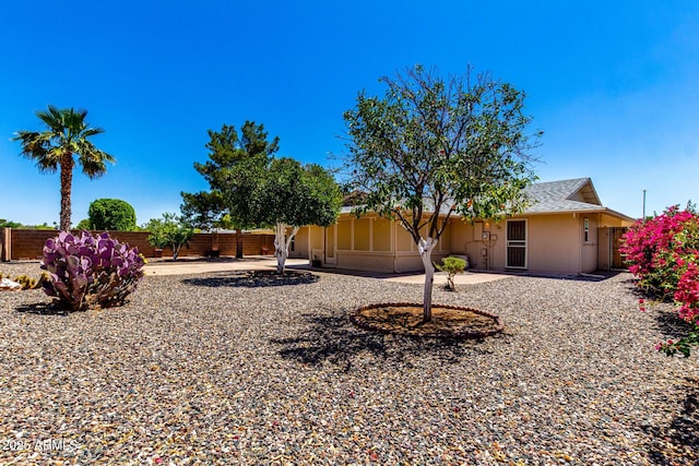 10126 W Sombrero Cir, Sun City, AZ 85373 - fenced backyard with a patio area