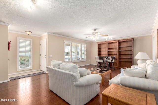 10126 W Sombrero Cir, Sun City, AZ 85373 - living room featuring a textured ceiling, ornamental molding, a ceiling fan, wood finished floors, and baseboards