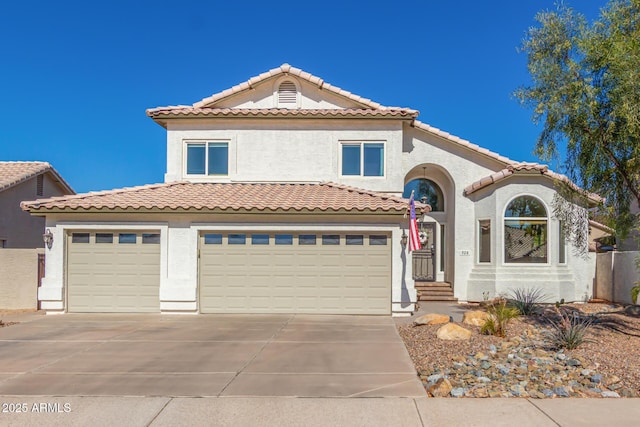 mediterranean / spanish home featuring a garage