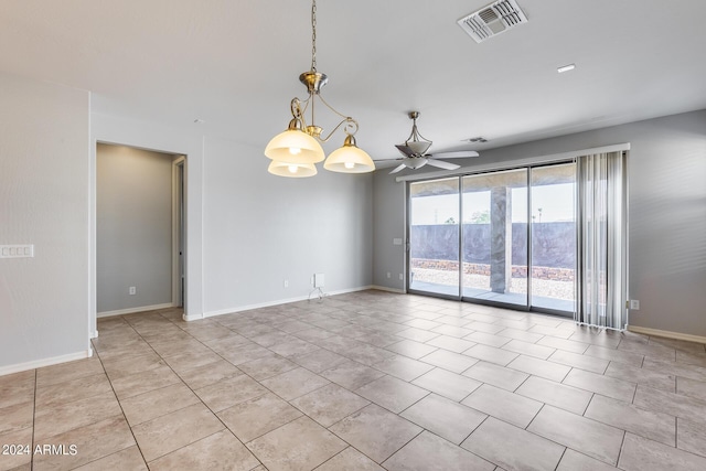 empty room featuring baseboards, visible vents, and ceiling fan with notable chandelier