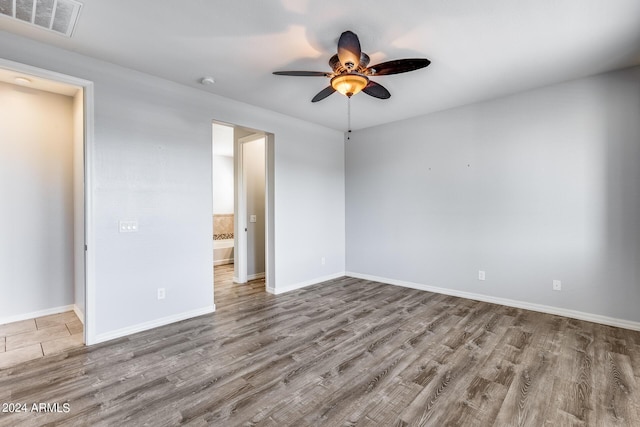 unfurnished bedroom with ceiling fan, light wood finished floors, visible vents, and baseboards