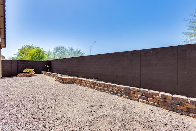 view of yard featuring a patio and a fenced backyard