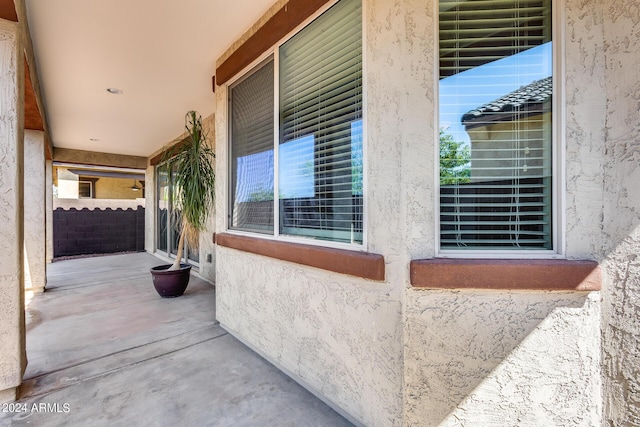 exterior space featuring a patio area and stucco siding