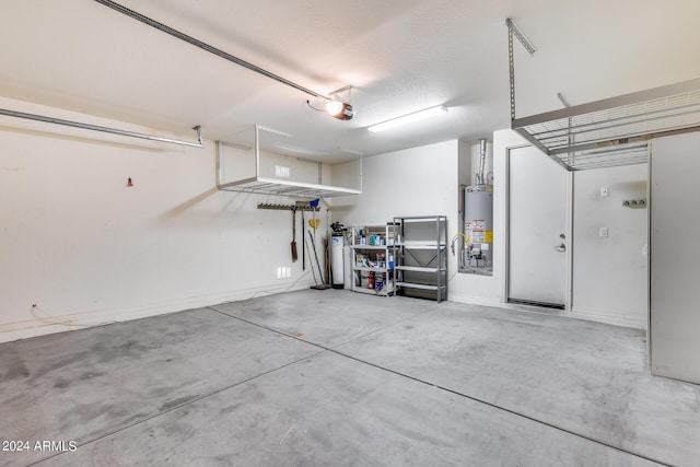 garage featuring a garage door opener and gas water heater