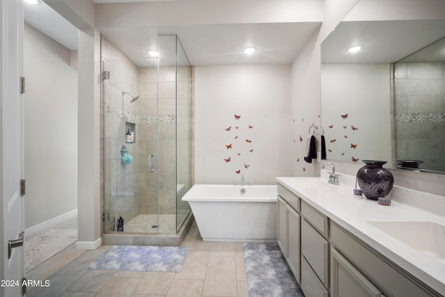 bathroom with separate shower and tub and vanity