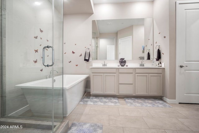 bathroom with tile patterned flooring, vanity, and independent shower and bath