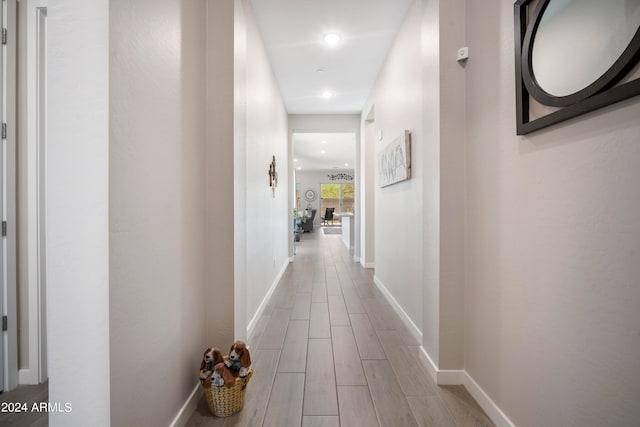 hall with light hardwood / wood-style floors