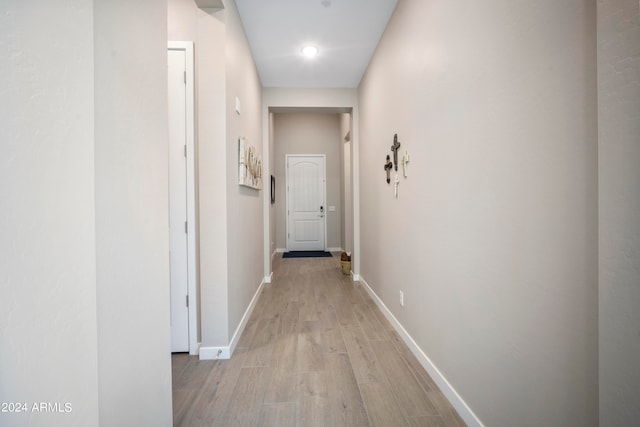 hall with light hardwood / wood-style floors