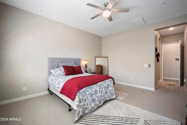 bedroom featuring ceiling fan and carpet