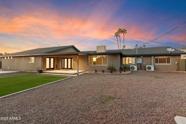 1801 E Berridge Ln, Phoenix, AZ 85016 - rear view of house featuring a cooling unit, a chimney, and a lawn