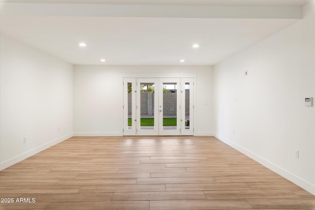 1801 E Berridge Ln, Phoenix, AZ 85016 - empty room with light wood finished floors, recessed lighting, french doors, and baseboards