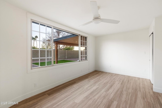 1801 E Berridge Ln, Phoenix, AZ 85016 - empty room with light wood-style flooring, baseboards, and ceiling fan
