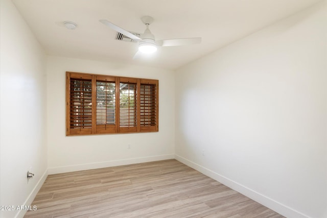 1801 E Berridge Ln, Phoenix, AZ 85016 - spare room featuring a ceiling fan, light wood-style flooring, baseboards, and a smoke detector