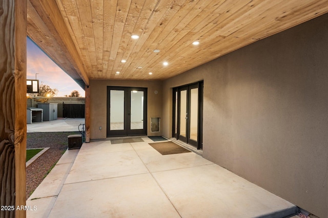 1801 E Berridge Ln, Phoenix, AZ 85016 - view of exterior entry featuring french doors, a patio, and stucco siding