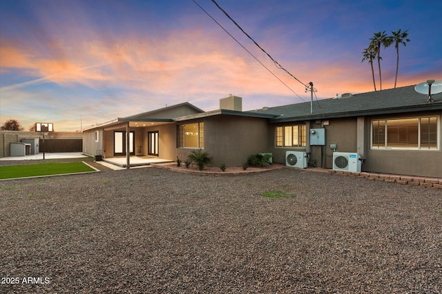 1801 E Berridge Ln, Phoenix, AZ 85016 - view of front of house featuring ac unit, a patio area, central AC unit, and stucco siding
