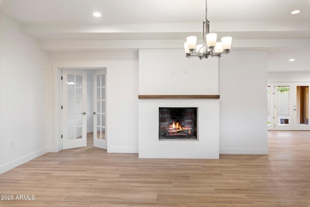 1801 E Berridge Ln, Phoenix, AZ 85016 - unfurnished living room featuring french doors, wood finished floors, recessed lighting, baseboards, and a chandelier