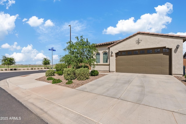2204 E Kelly Dr, Gilbert, AZ 85298 - mediterranean / spanish-style house featuring a tile roof, a garage, concrete driveway, and stucco siding