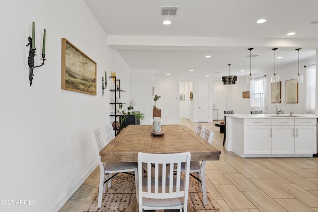 2204 E Kelly Dr, Gilbert, AZ 85298 - dining space with baseboards, visible vents, recessed lighting, and wood finish floors