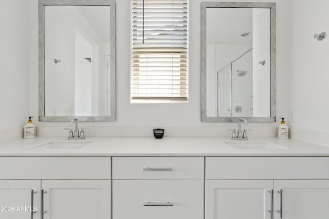 2204 E Kelly Dr, Gilbert, AZ 85298 - full bathroom featuring a shower stall, double vanity, and a sink