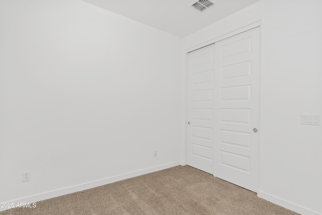 2204 E Kelly Dr, Gilbert, AZ 85298 - unfurnished bedroom with baseboards, visible vents, a closet, and carpet floors