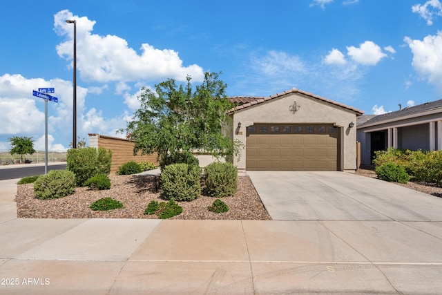 2204 E Kelly Dr, Gilbert, AZ 85298 - view of front of home with a tiled roof, a garage, concrete driveway, and stucco siding
